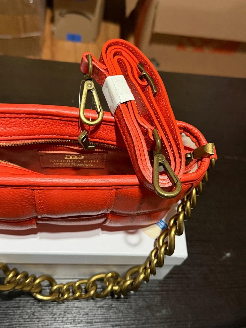 Monica Bini Orange pebbled small shoulder bag zip closure gold chain strap.